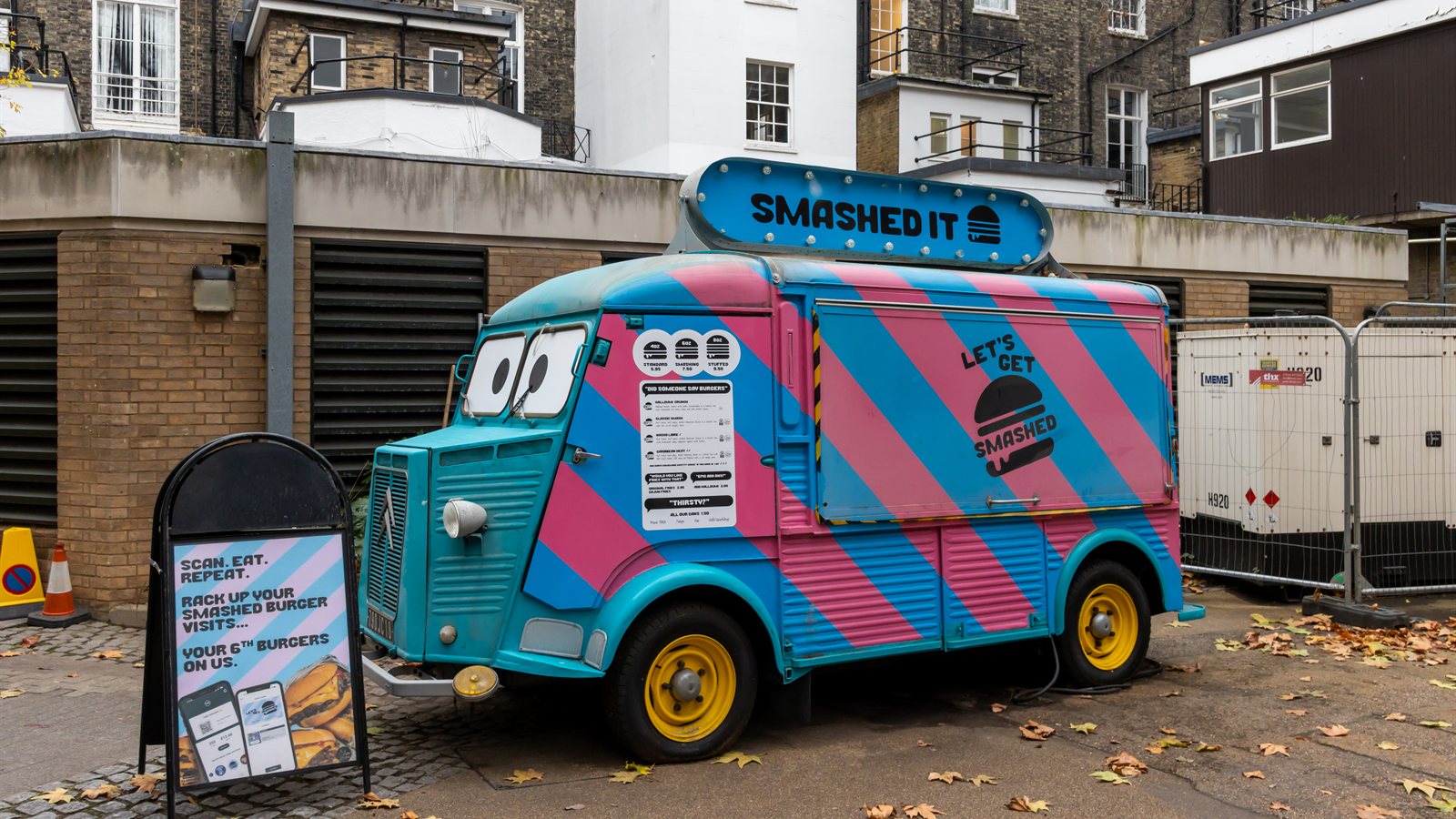 Brightly painted vintage food truck parked on a street